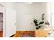 Bright office space featuring hardwood floors, white walls, and a large window for natural light at 321 Fox St, Denver, CO 80223