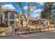 Two-story home with brick facade and landscaping at 2111 E Alameda Ave, Denver, CO 80209