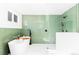 Modern bathroom with a soaking tub, walk-in shower, and green tile at 2520 S Race St, Denver, CO 80210