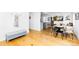 Bright dining room featuring hardwood floors, natural light and adjacent kitchen space at 2520 S Race St, Denver, CO 80210