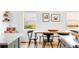 Bright dining room featuring adjacent kitchen, hardwood floors, and warm natural light at 2520 S Race St, Denver, CO 80210
