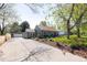 Charming single-Gathering home featuring well-manicured lawn, a detached garage, and a long drive way at 2520 S Race St, Denver, CO 80210