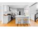 Modern kitchen featuring gray and white cabinets, stainless steel appliances, and a stylish breakfast bar at 2520 S Race St, Denver, CO 80210