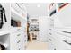 Custom walk-in closet with built-in shelving and drawers for organized storage at 2520 S Race St, Denver, CO 80210