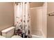 Well-lit bathroom featuring a shower/tub combination with a decorative butterfly-themed shower curtain at 1575 Olympia Cir # 307, Castle Rock, CO 80104