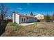 Fenced backyard with patchy grass and a small patio at 19000 E Mansfield Dr, Aurora, CO 80013
