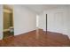 Spacious bedroom with wood floors, ensuite bath with tiled stand-up shower and closet at 19000 E Mansfield Dr, Aurora, CO 80013