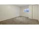 Carpeted bedroom with a window and closet featuring white walls and trim at 19000 E Mansfield Dr, Aurora, CO 80013