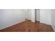 This bedroom features wood floors, white walls, base trim and closet at 19000 E Mansfield Dr, Aurora, CO 80013
