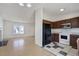 Eat-in kitchen featuring tile floors, white appliances, brown cabinets and a window view at 19000 E Mansfield Dr, Aurora, CO 80013