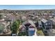 Aerial view showcases a red home in a neighborhood with well-maintained lawns and mature trees at 9408 High Cliffe St, Highlands Ranch, CO 80129