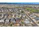 Panoramic aerial view showing a red house in a residential neighborhood near a park and distant mountains at 9408 High Cliffe St, Highlands Ranch, CO 80129