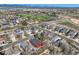 A neighborhood aerial view showcases a red home among tree-lined streets, near parks and green spaces at 9408 High Cliffe St, Highlands Ranch, CO 80129