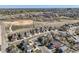Aerial view of neighborhood showcasing a red home near green space and other residential properties at 9408 High Cliffe St, Highlands Ranch, CO 80129