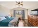 A comfortable bedroom showcases vaulted ceilings, hardwood floors, and a large window with natural light at 9408 High Cliffe St, Highlands Ranch, CO 80129