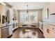 Cozy breakfast nook featuring a marble table set, bright window view and elegant cabinetry at 9408 High Cliffe St, Highlands Ranch, CO 80129