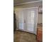 French doors with blinds, enhancing natural light in the kitchen space at 15003 Olmsted Dr, Denver, CO 80239