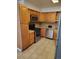 Modern kitchen featuring stainless steel appliances and ample wooden cabinet space at 15003 Olmsted Dr, Denver, CO 80239