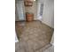 Well-lit eat-in kitchen area with tiled flooring, cabinet storage and glass doors at 15003 Olmsted Dr, Denver, CO 80239