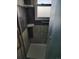 Shower stall with gray tile walls and safety bar at 15003 Olmsted Dr, Denver, CO 80239