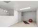 Finished basement with white walls and carpet, suitable for a gym or recreational area at 1723 E 16Th Ave, Denver, CO 80218