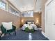 Spacious bedroom featuring brick walls, large windows, and stylish furnishings at 1723 E 16Th Ave, Denver, CO 80218