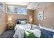 Bright bedroom with large window, ceiling fan, and cozy décor at 1723 E 16Th Ave, Denver, CO 80218