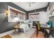 Charming bedroom with natural light, hardwood floors, and comfortable furnishings at 1723 E 16Th Ave, Denver, CO 80218