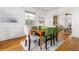 Dining room features natural light, hardwood floors, and adjacent kitchen at 1723 E 16Th Ave, Denver, CO 80218
