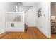 Inviting entryway with hardwood floors, a staircase, and neutral decor at 1723 E 16Th Ave, Denver, CO 80218