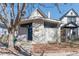 Charming home exterior featuring a modern design with large windows and blue front door at 1723 E 16Th Ave, Denver, CO 80218
