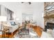 Bright living room boasts a stone fireplace, hardwood floors, and neutral decor for a cozy feel at 1723 E 16Th Ave, Denver, CO 80218