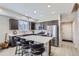 Modern kitchen with white countertops, dark cabinetry, and stainless steel appliances at 6492 N Ceylon St, Denver, CO 80249