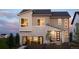 Modern two-story home showcasing a stone facade, large windows and manicured landscaping at 6304 Las Conchas Pt, Parker, CO 80134