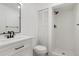 Modern bathroom features white cabinets with black hardware and a walk-in shower at 6539 Pinewood Dr # 57, Parker, CO 80134