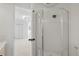 Bathroom featuring modern glass enclosed shower and access to the bedroom at 6539 Pinewood Dr # 57, Parker, CO 80134