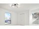 Well-lit bedroom with two windows, and modern light fixture at 6539 Pinewood Dr # 57, Parker, CO 80134