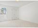 Bright bedroom featuring neutral carpet and large closet at 6539 Pinewood Dr # 57, Parker, CO 80134