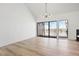 Bright living room with a vaulted ceiling, modern lighting, and sliding glass doors at 6539 Pinewood Dr # 57, Parker, CO 80134