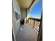 Cozy balcony with seating and a view of the surrounding landscape at 15455 Canyon Rim Dr # 307, Englewood, CO 80112