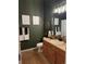 Stylishly decorated bathroom featuring a vanity with wood cabinets, decorative accents, and modern lighting at 15455 Canyon Rim Dr # 307, Englewood, CO 80112