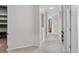 Bright hallway features tile floors, arches, and white paint at 15455 Canyon Rim Dr # 307, Englewood, CO 80112