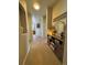 Warm and inviting hallway with decorative niche and stylish console table at 15455 Canyon Rim Dr # 307, Englewood, CO 80112