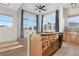 Bright kitchen boasts a large island, ample natural light, and modern finishes at 15455 Canyon Rim Dr # 307, Englewood, CO 80112