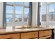 Bright kitchen featuring granite countertops, modern faucet, and large windows for ample natural light at 15455 Canyon Rim Dr # 307, Englewood, CO 80112