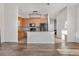 Kitchen with wood cabinets, center island, and open floor plan at 15455 Canyon Rim Dr # 307, Englewood, CO 80112
