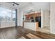 Open concept featuring wood floors with an eat in kitchen and natural light at 15455 Canyon Rim Dr # 307, Englewood, CO 80112
