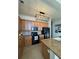 Well-equipped kitchen features granite counters, modern appliances, and ample cabinet space at 15455 Canyon Rim Dr # 307, Englewood, CO 80112