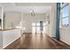 Bright living room with wood floors, natural light, and stylish lighting at 15455 Canyon Rim Dr # 307, Englewood, CO 80112