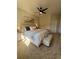 Spacious main bedroom featuring plush carpeting, a ceiling fan, and a decorative art piece at 15455 Canyon Rim Dr # 307, Englewood, CO 80112